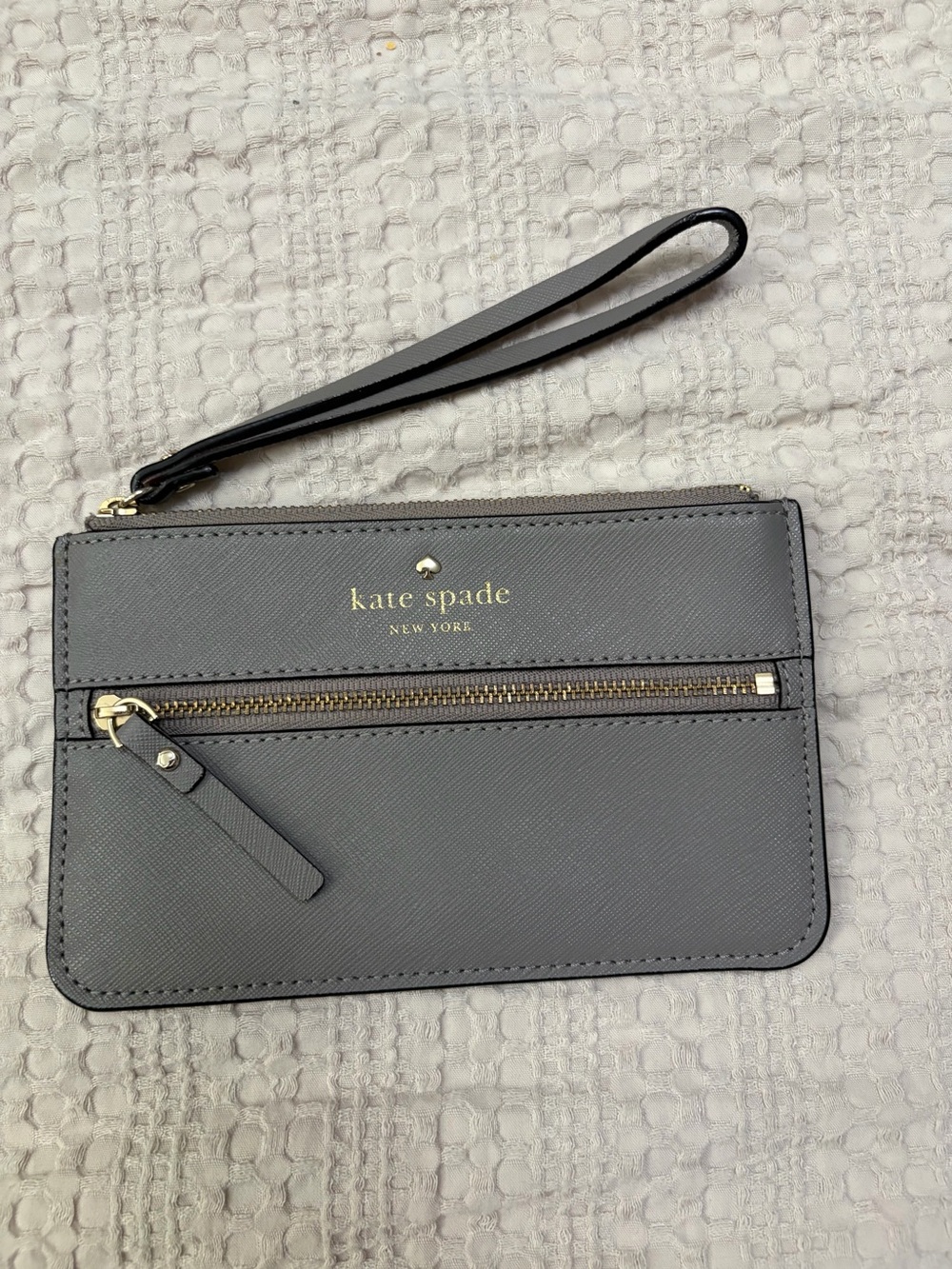 kate spade gray wristlet with gold hardware